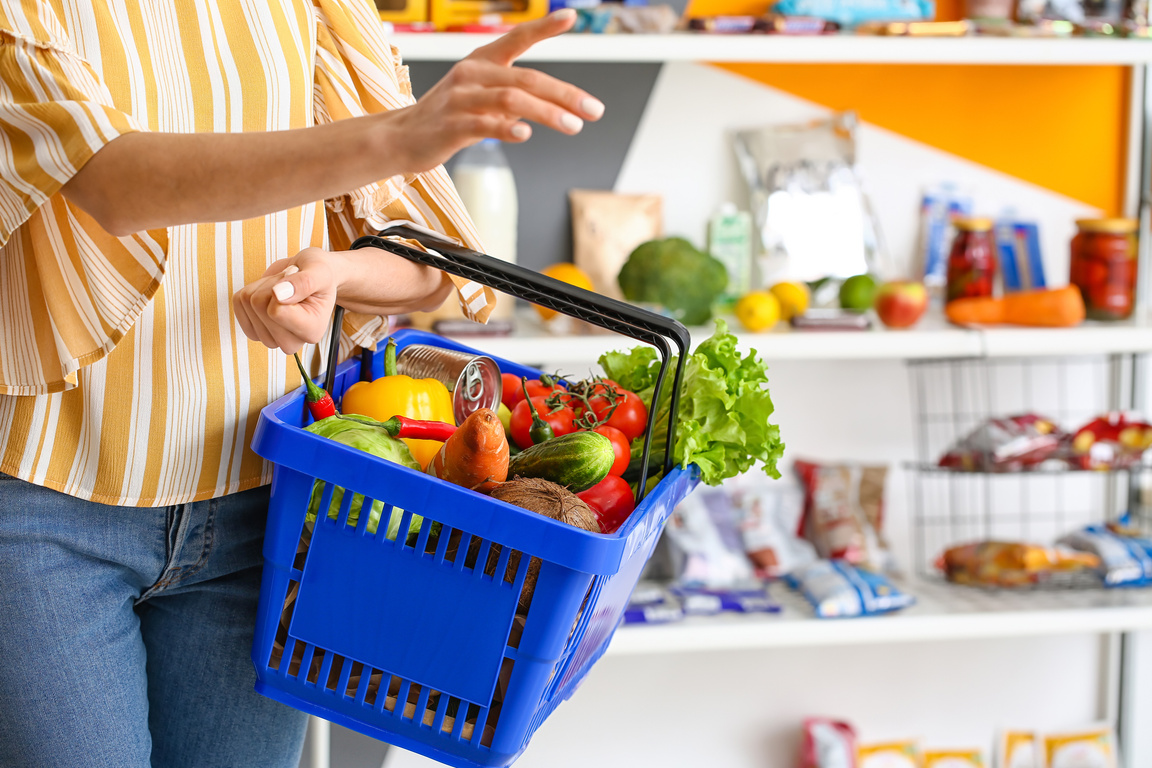 Woman Buying Food in Supermarket